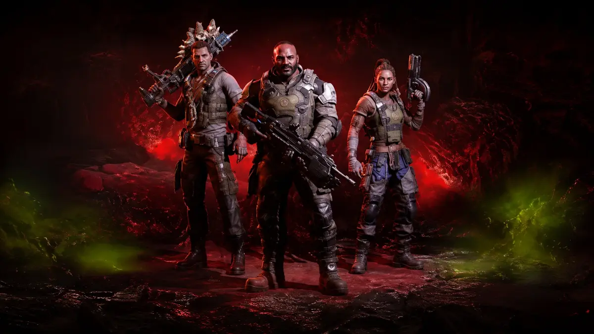 Gears of War E-Day image showing three armed soldiers standing in a red-lit battlefield environment, prepared for combat during the Locust invasion.